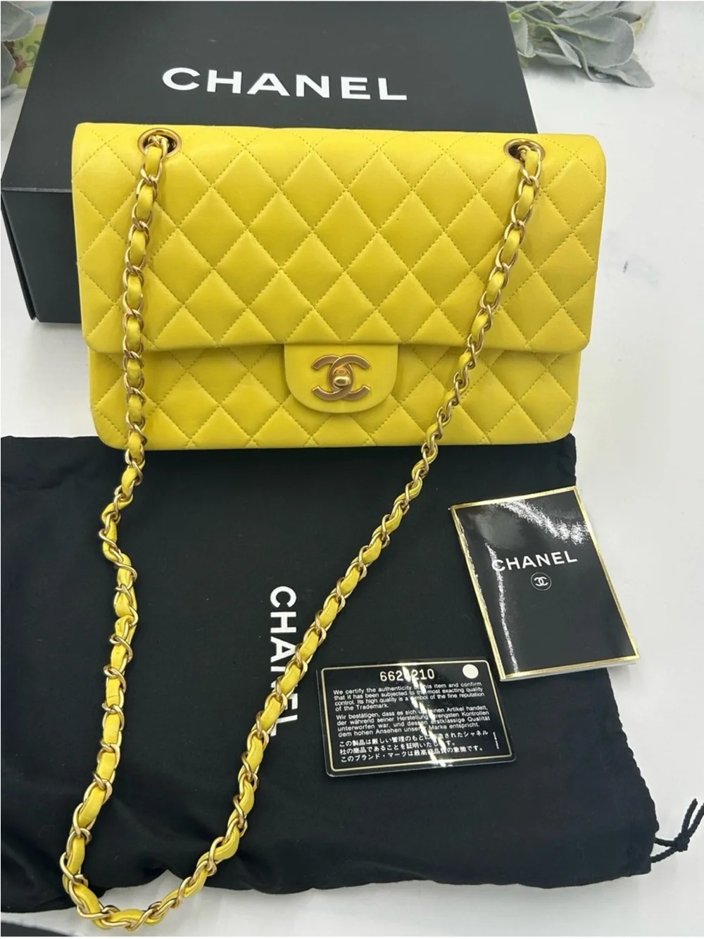 CHANEL CLASSIC QUILTED double flap bag . Yellow with gold hardware .